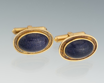 A Pair of Gold and Sunstone Glass