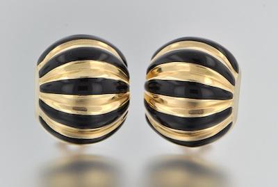A Pair of Gold and Black Enamel
