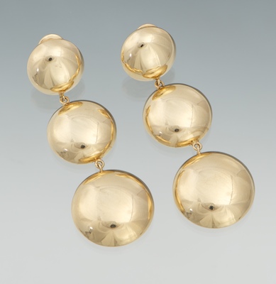 A Pair of Gold Circle Pendant Ear