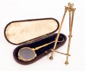 A pair of gold coloured metal