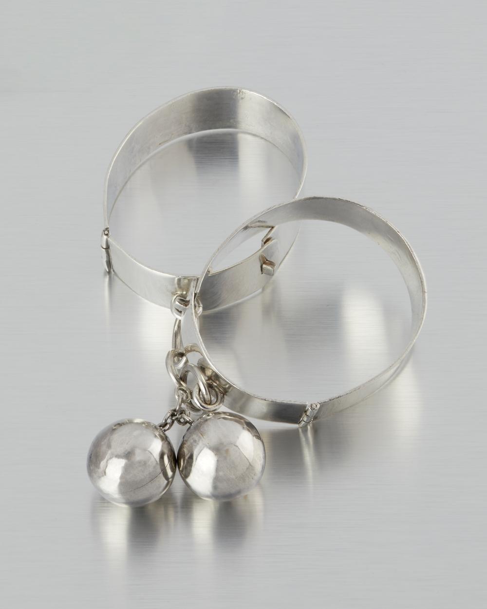 A PAIR OF HUBERT HARMON SILVER