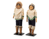 A PAIR OF INUIT CARVED WOOD DO