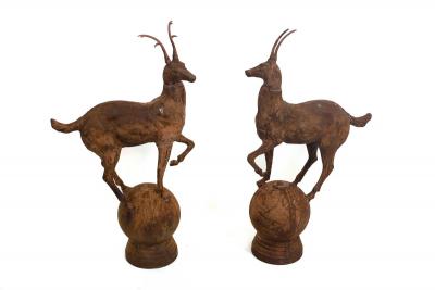 A pair of iron gate pier finials