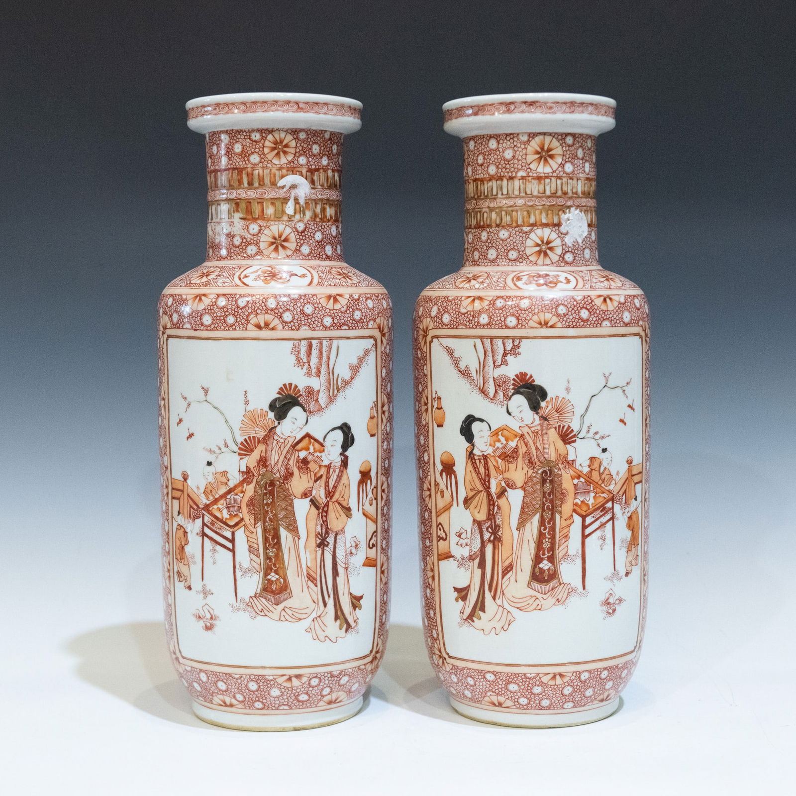 A PAIR OF IRON RED 'FIGURAL'