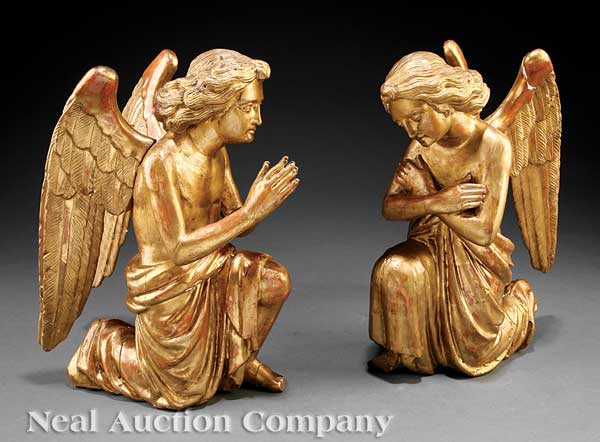 A Pair of Italian Carved and