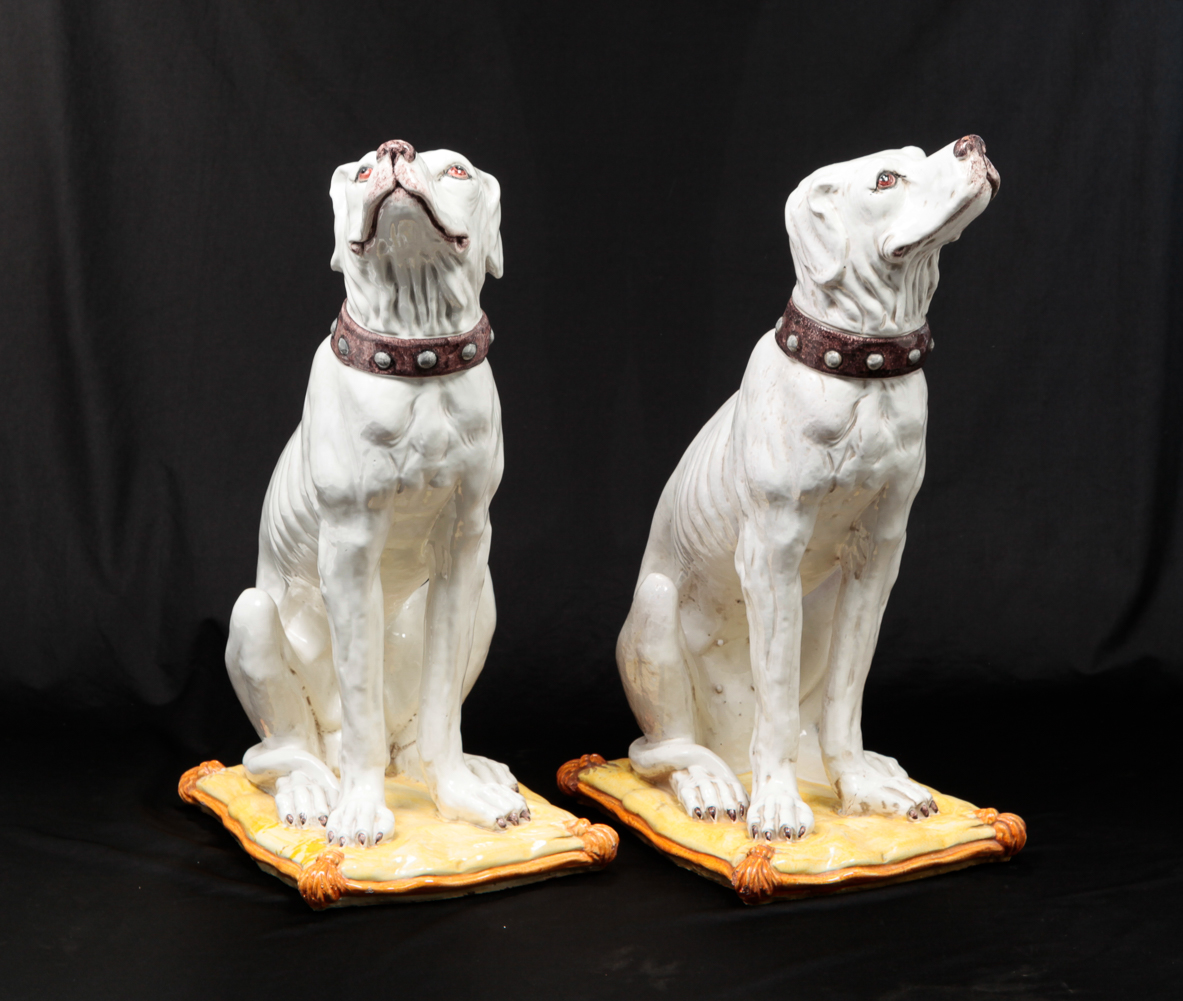 A PAIR OF ITALIAN FAIENCE DOGS.