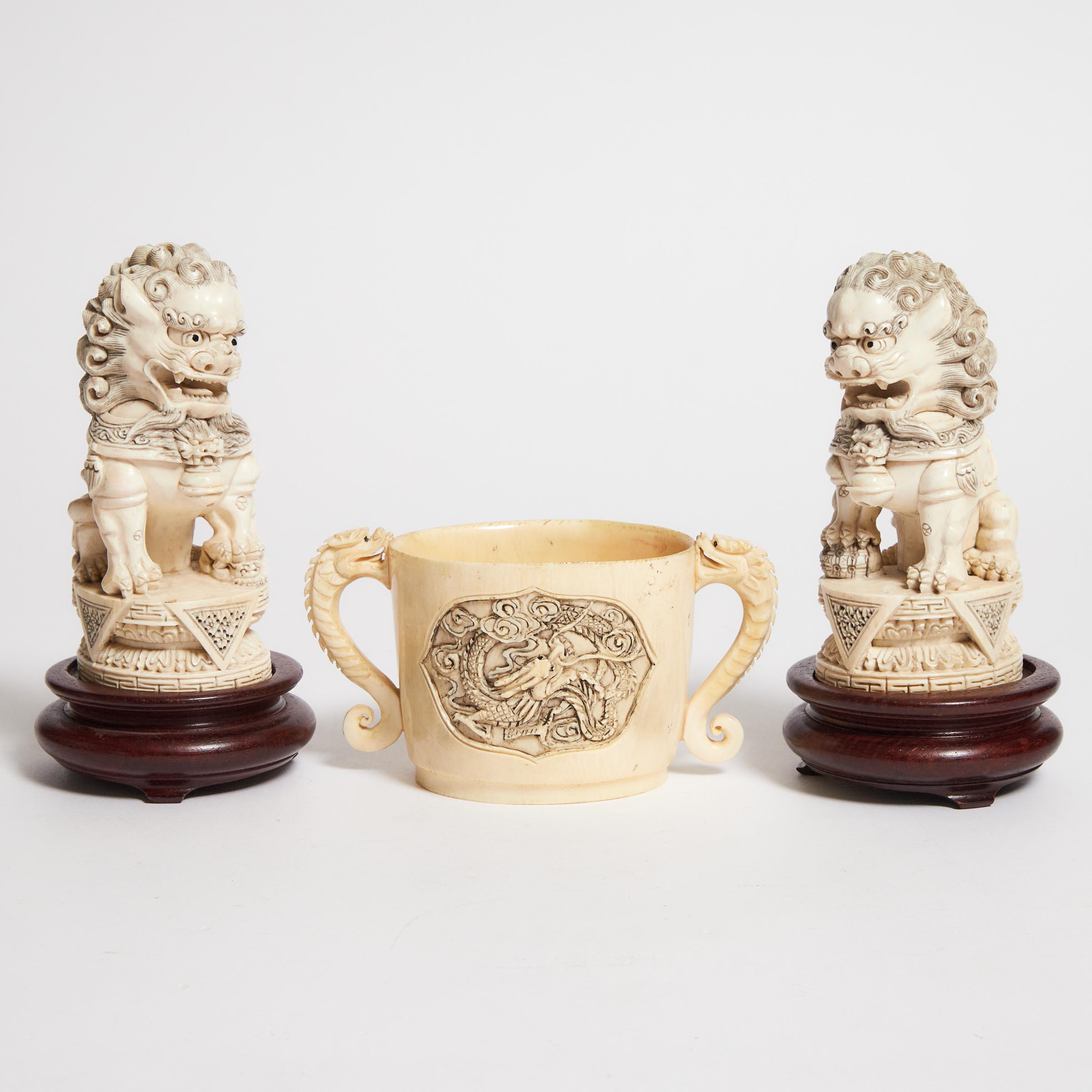 A Pair of Ivory Buddhist Lions,