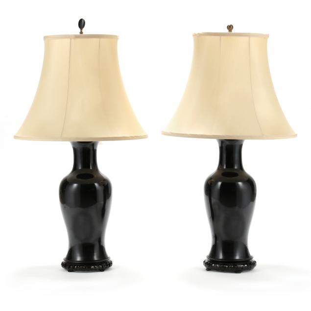A PAIR OF LARGE BLACK MIRROR GLAZED