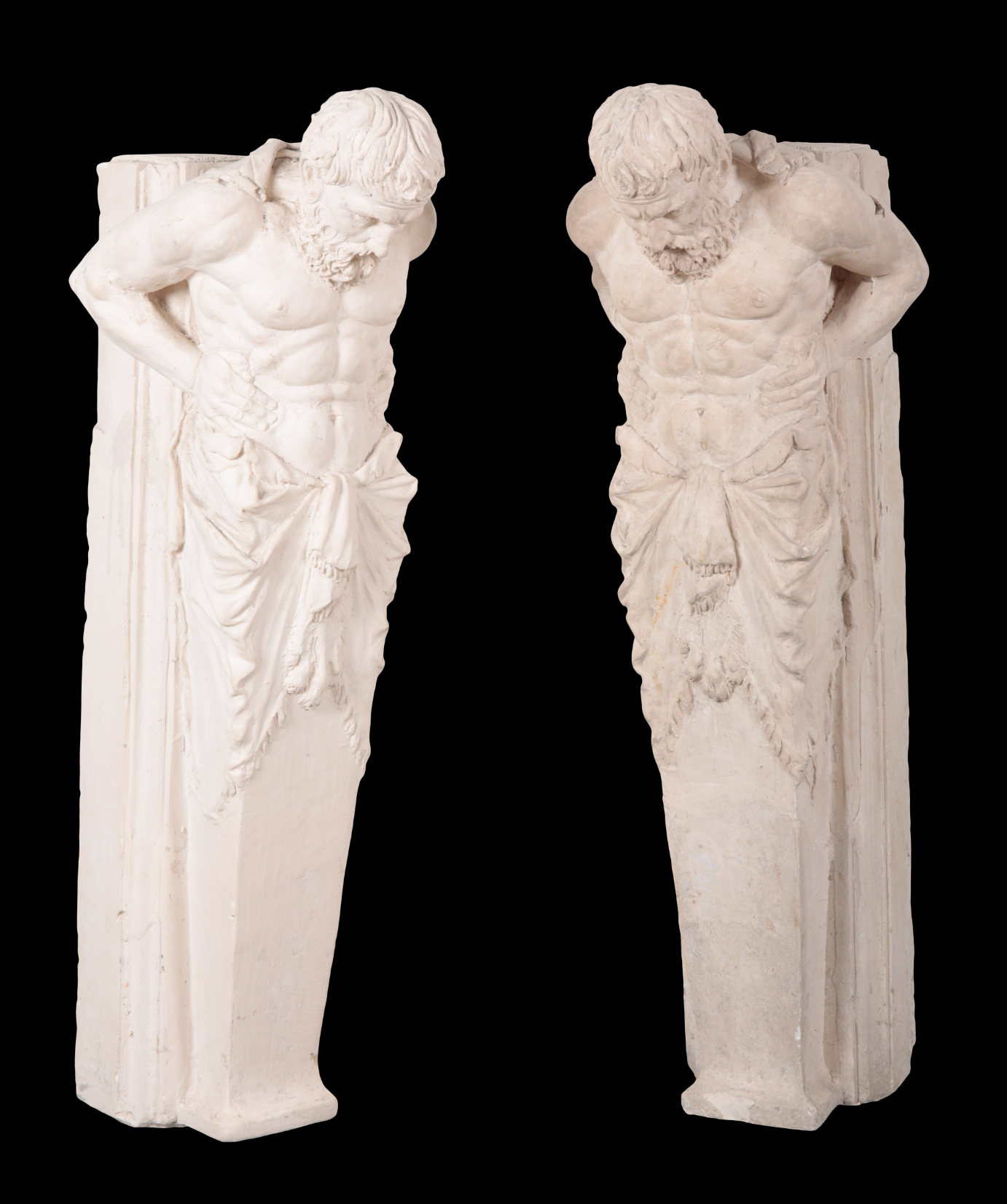 A PAIR OF LARGE PLASTER ATLANTES as