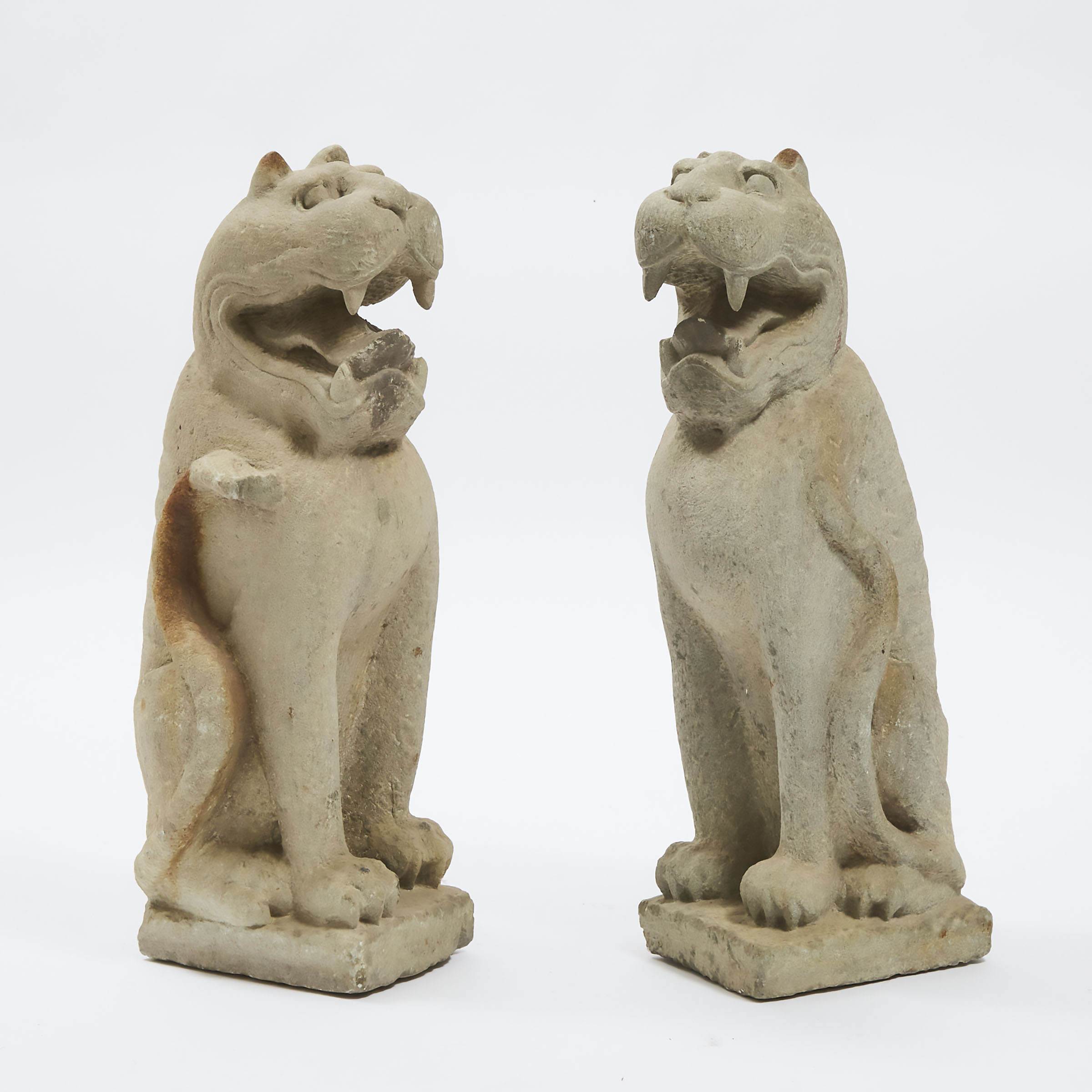 A Pair of Large Stone Seated