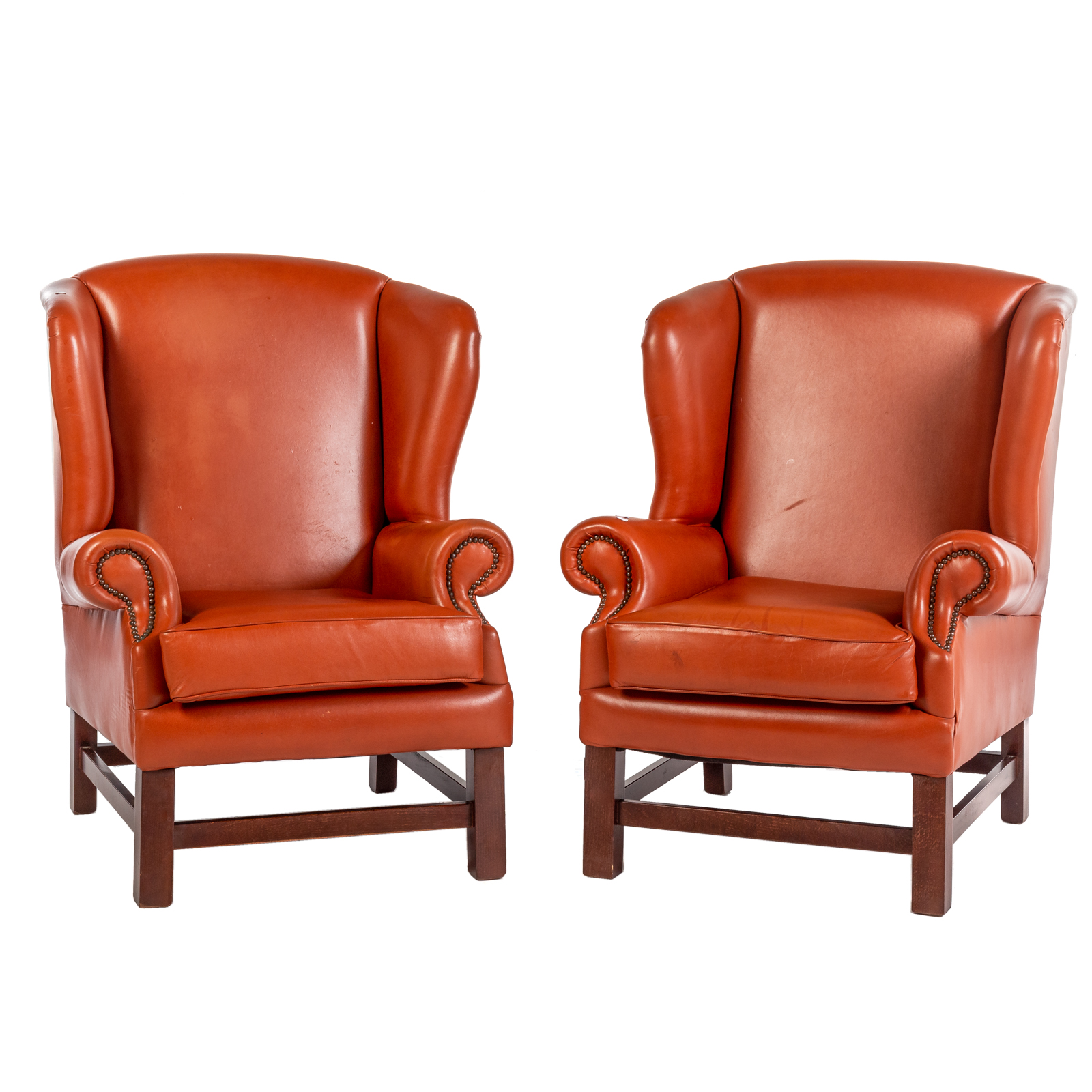 A PAIR OF LEATHER WING CHAIRS