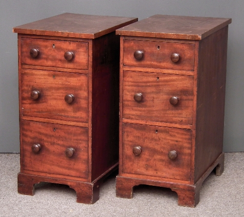 A pair of mahogany bedside chests