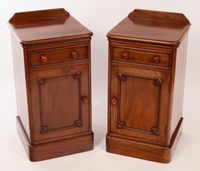 A pair of mahogany bedside
