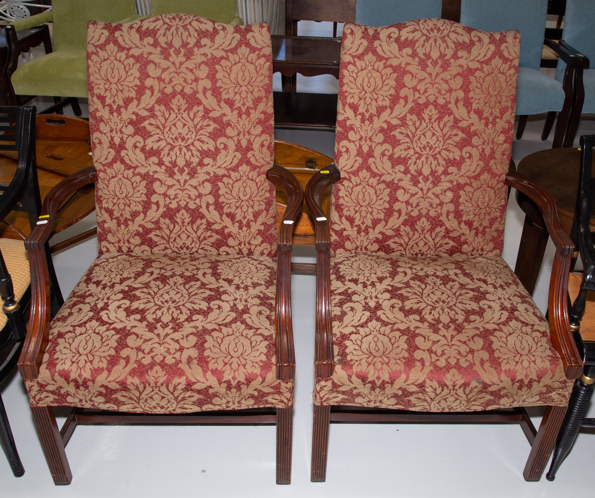 A PAIR OF MAHOGANY LOLLING CHAIRS