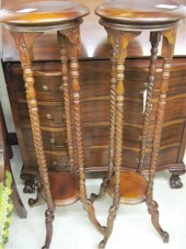 A PAIR OF MAHOGANY PEDESTAL PL