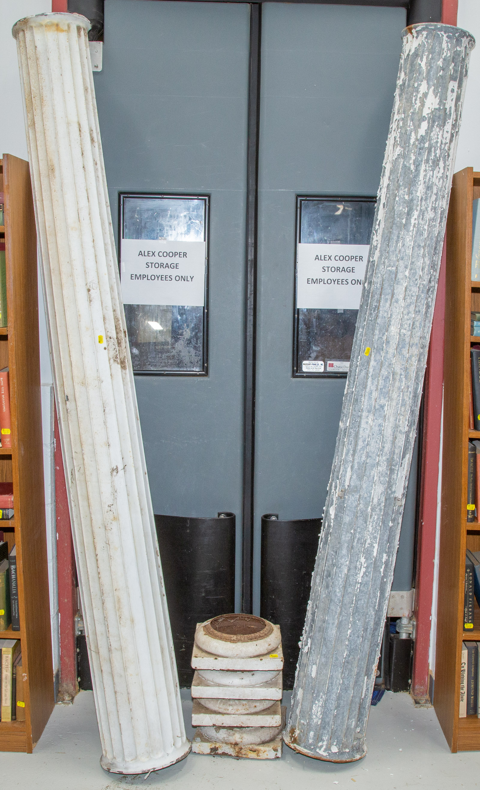 A PAIR OF METAL DORIC STYLE COLUMNS