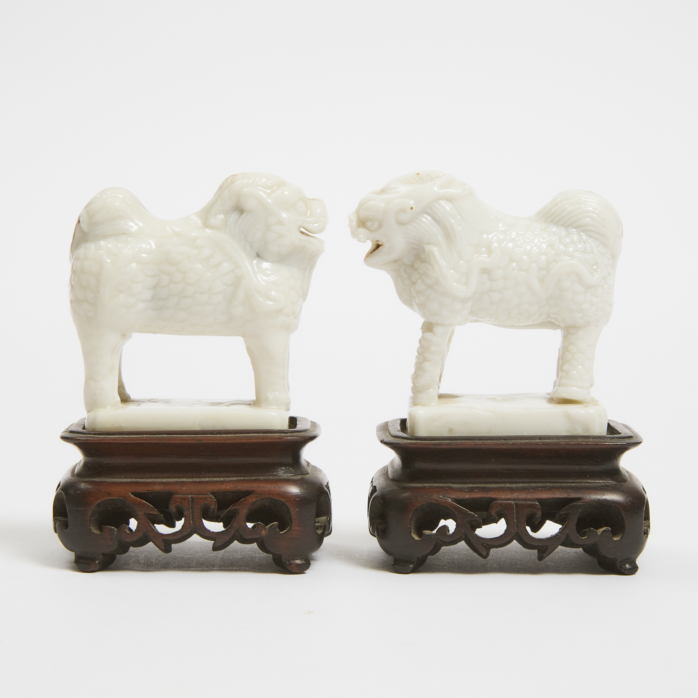 A Pair of Miniature Dehua Figures