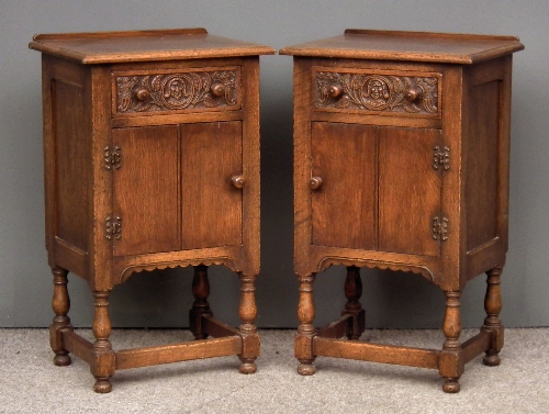 A pair of oak bedside cabinets of