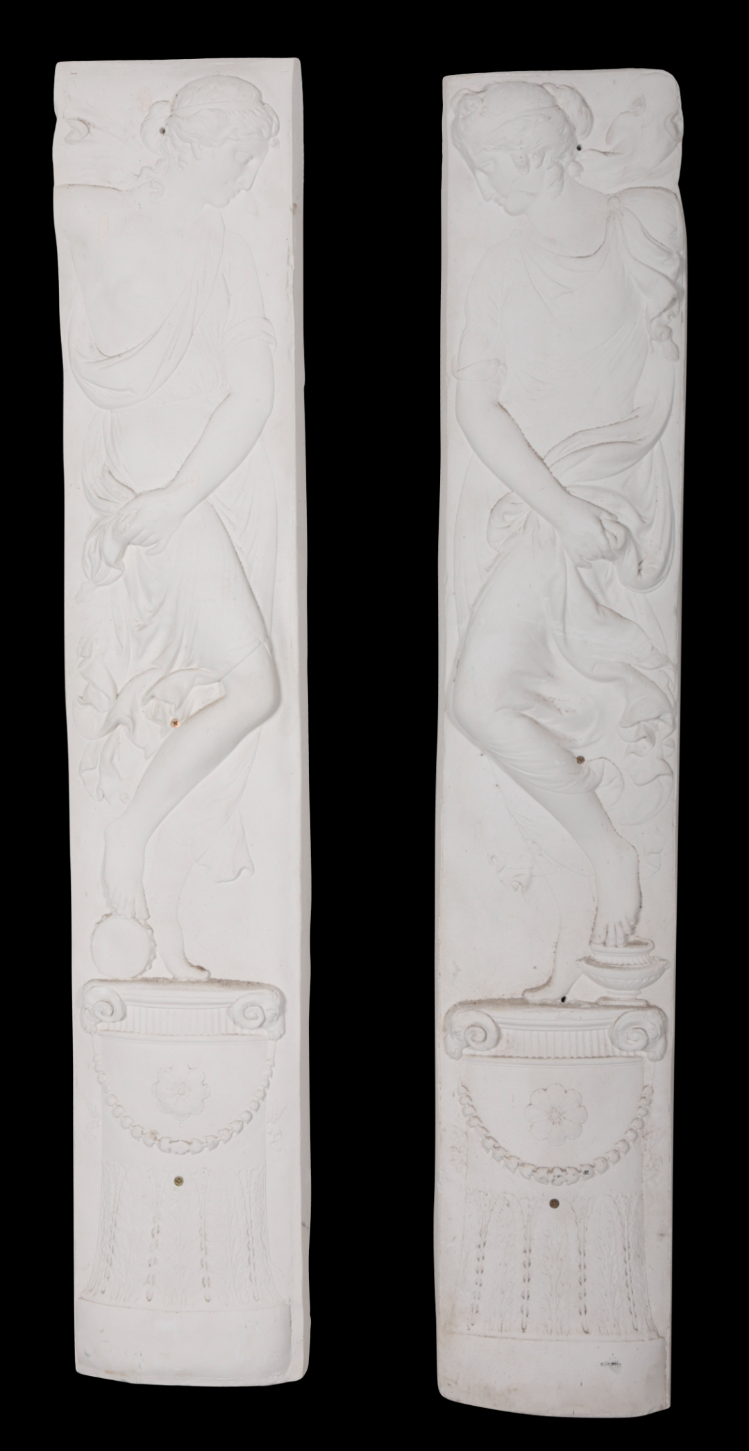 A PAIR OF OPPOSING PLASTER