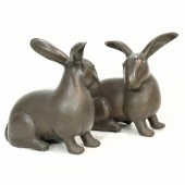 A PAIR OF PATINATED COPPER FIG