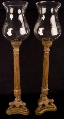 A pair of patinated metal candle