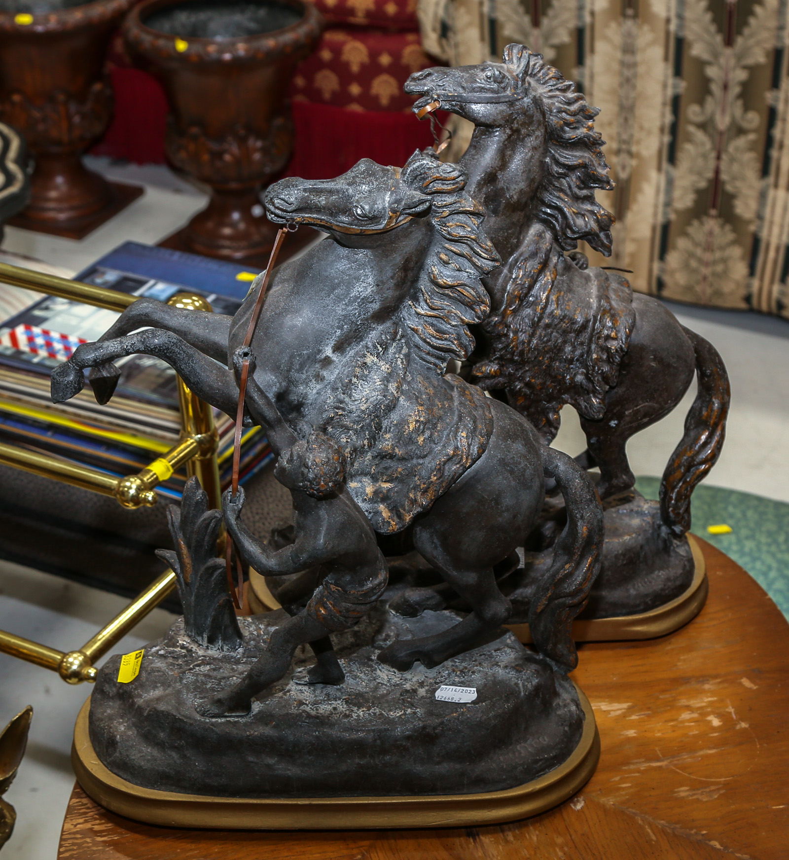 A PAIR OF PATINATED METAL