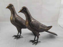 A pair of Persian sculptured iron
