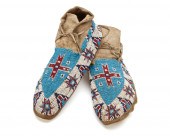A PAIR OF PLAINS BEADED HIDE M