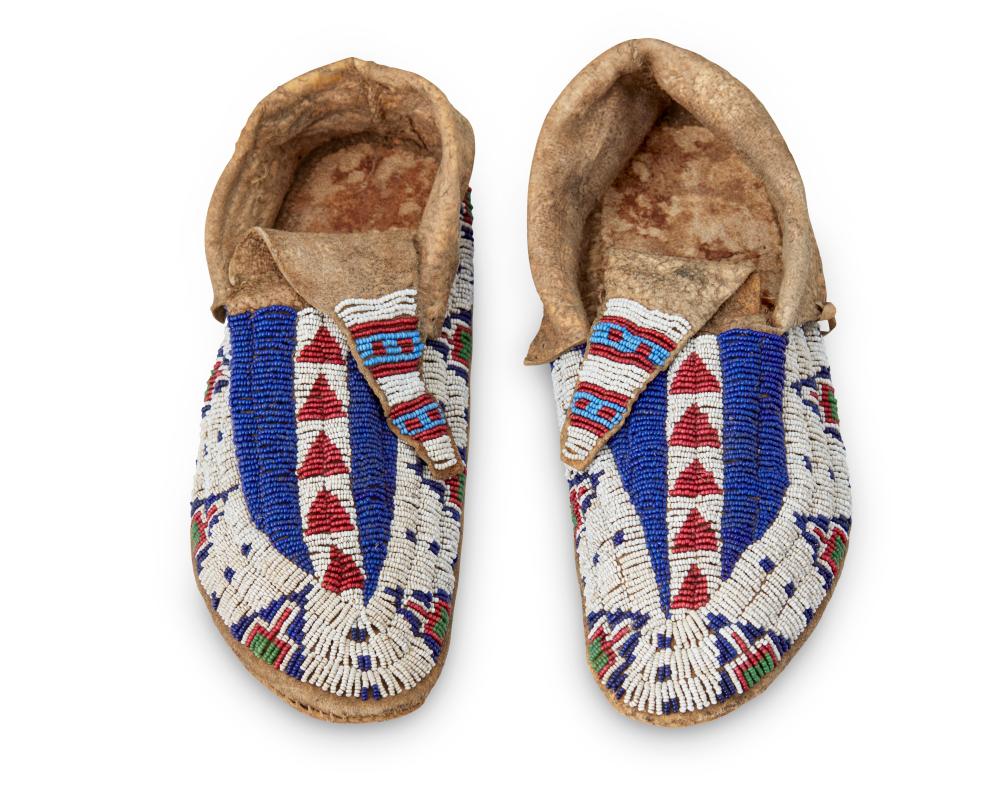 A PAIR OF PLAINS BEADED