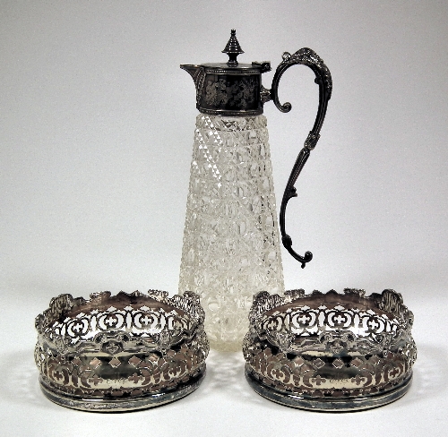 A pair of plated wine coasters with