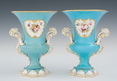 A Pair of Porcelain Urns The double