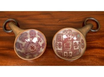 A pair of pottery drinking