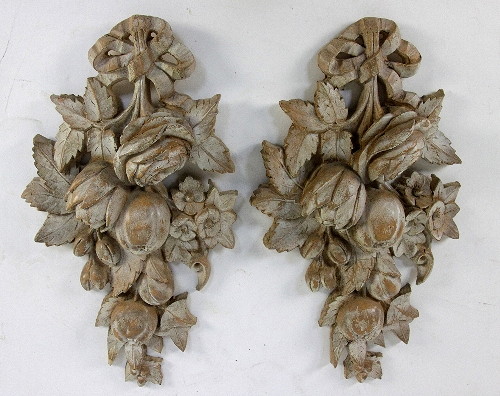 A pair of pottery wall plaques to