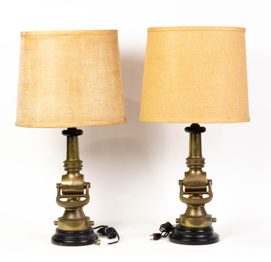 A PAIR OF POWHATAN BRONZE FIRE