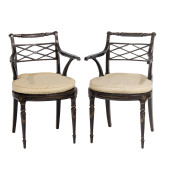 A PAIR OF REGENCY EBONIZED AND
