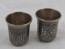 A pair of Russian silver vodka tots
