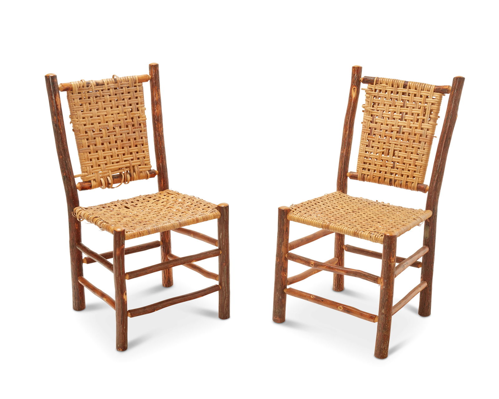 A PAIR OF RUSTIC CANED HICKORY SIDE