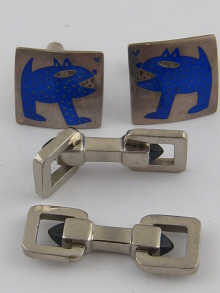 A pair of silver and enamel