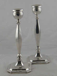 A pair of silver candlesticks