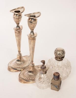 A pair of silver candlesticks,