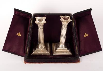 A pair of silver candlesticks,