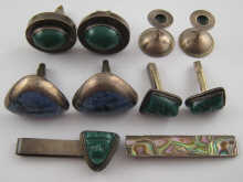 A pair of silver cufflinks maker