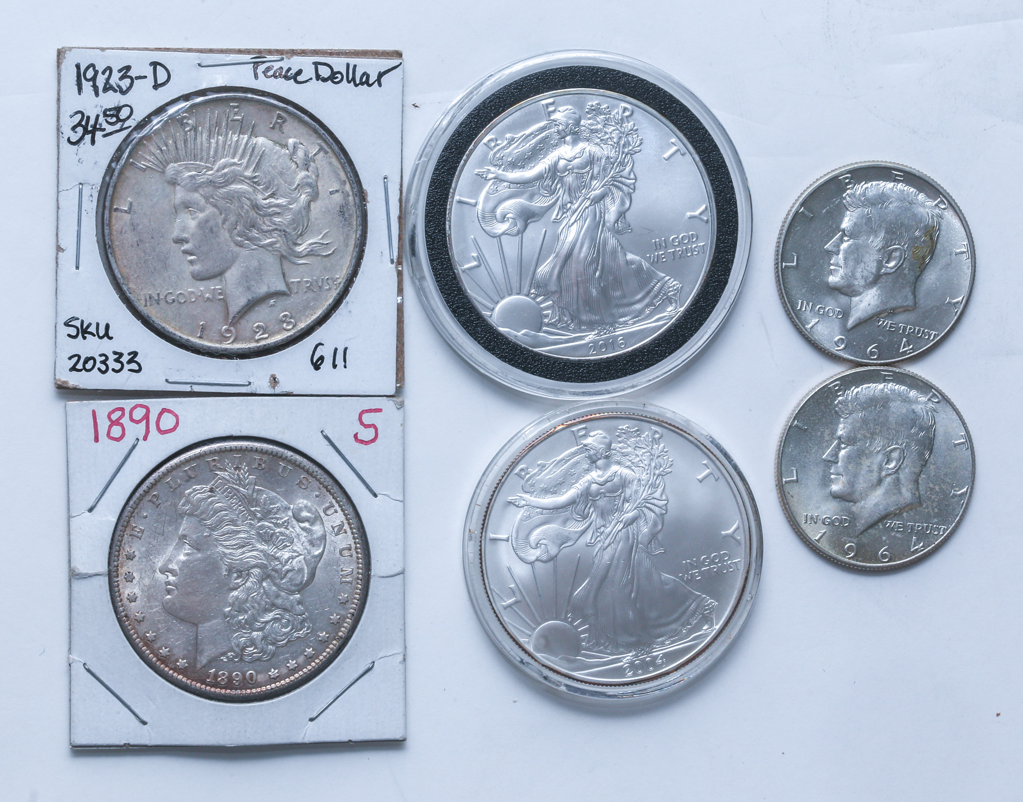 A PAIR OF SILVER DOLLARS, SILVER