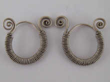 A pair of silver earrings of