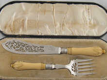 A pair of silver fish servers