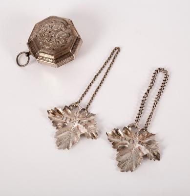 A pair of silver leaf-shaped