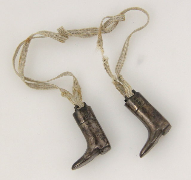 A pair of silver miniature riding