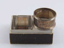 A pair of silver napkin rings