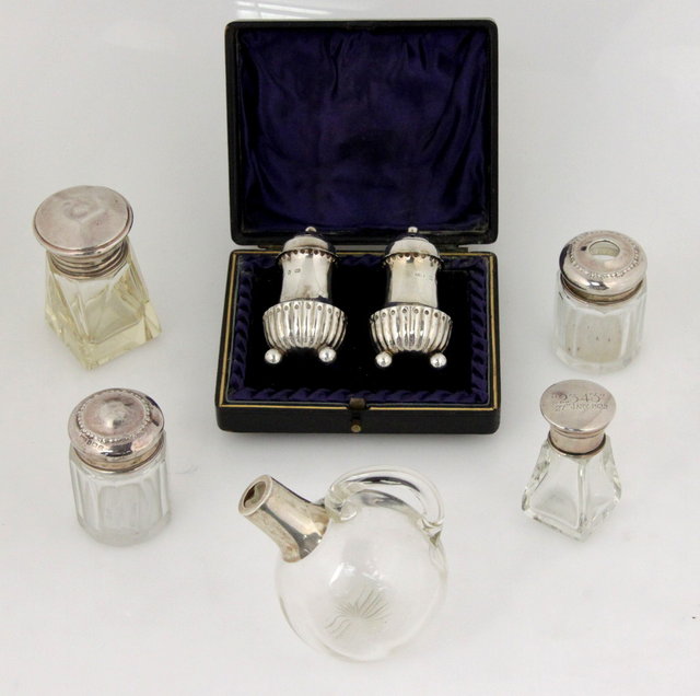 A pair of silver pepper pots H&T
