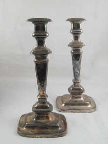 A pair of silver plate candlesticks